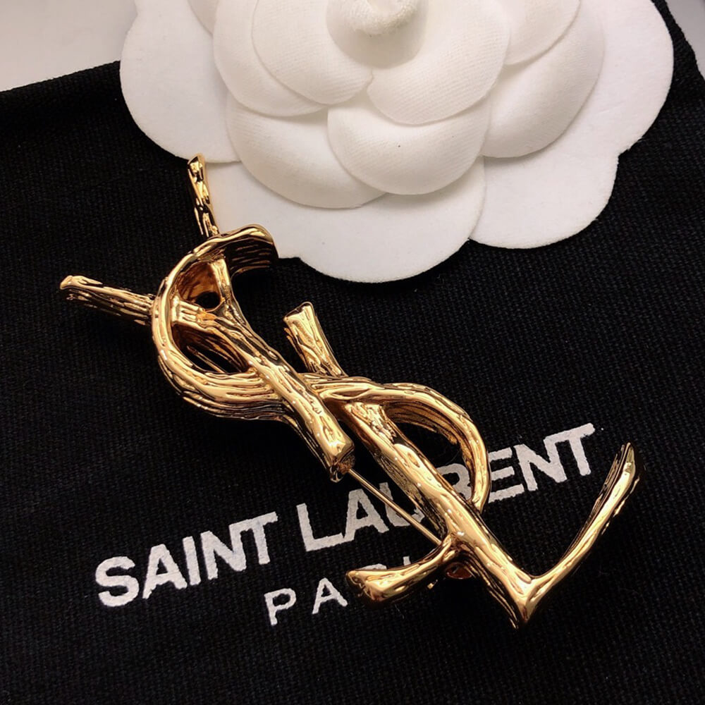 YSL CASSANDRE BROOCH IN METAL