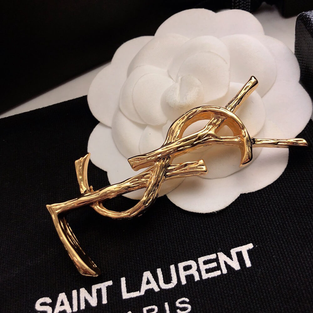YSL CASSANDRE BROOCH IN METAL
